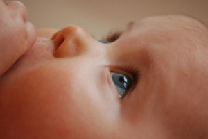 Close up of a baby's face looking up