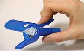 Eye drops bottle placed in an insertion aid