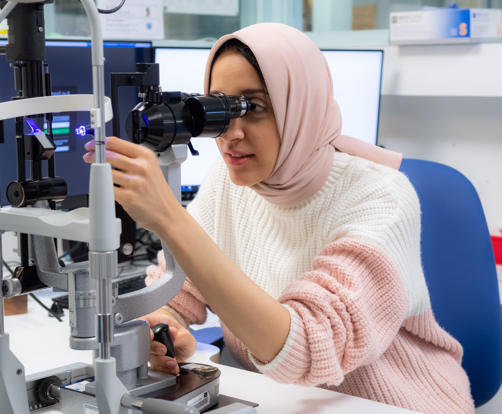Moorfields staff member using a slit lamp