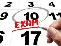 Close-up of a calendar with the number 10 circled and 'exam' written in red beneath