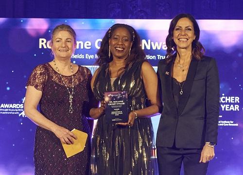 Prof Roxanne Crosby standing with two other people at the nursing awards