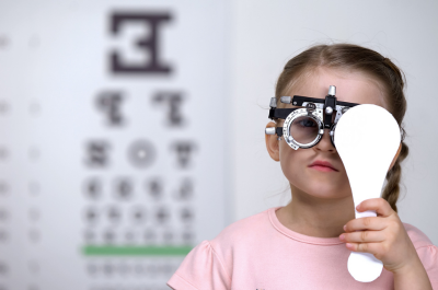 A young girl at the vision test