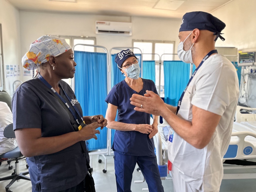 Medical professionals talking together in a Rwandan hospital