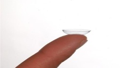 Photo of Soft Contact Lens  on a fingertip before insertion